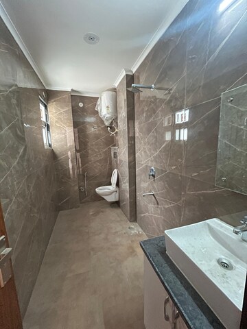 Bathroom in 4 BHK Builder Floor at Freedom Fighters Enclave – for Rent