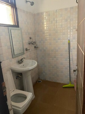 Bathroom in 2 BHK Apartment at Guru Nanak Enclave, Dhakoli – for Sale