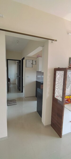 Living Room in 2 BHK Apartment at Rustomjee Global City, Virar West – for Sale