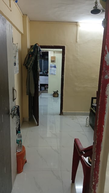 Living Room in 1 BHK Apartment at Devdoot CHS, Majiwada – for Sale