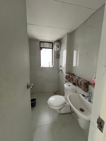 Bathroom in 1 BHK Apartment at Runwal Gardens Phase I, Dombivli East – for Rent