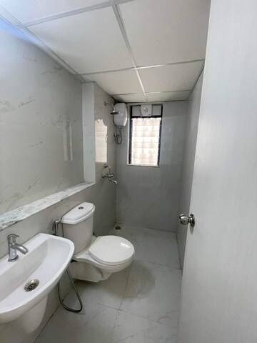 Bathroom in 1 BHK Apartment at Runwal Gardens, Dombivli East – for Rent