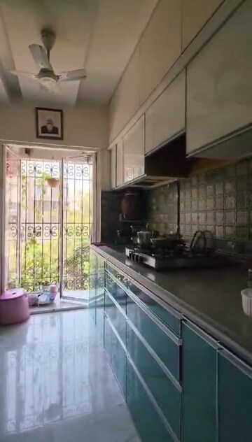 Kitchen in 2 BHK Apartment at Oceanic Apartment, Andheri West – for Sale