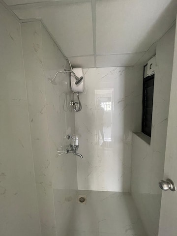 Bathroom in 1 BHK Apartment at Runwal Gardens, Dombivli East – for Rent