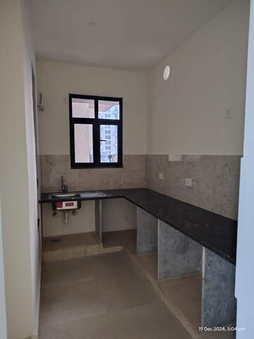 Kitchen in 1.5 BHK Apartment at Chhatikara – for Sale