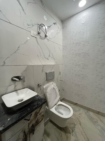 Bathroom in 3 BHK Apartment at Rohini Sector 23 – for Sale