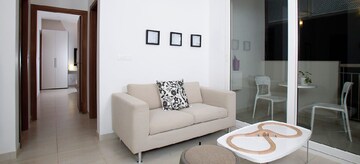 Living Room in 2 BHK Apartment at Bhartiya Nikoo Homes Phase 2, Thanisandra Main Road – for Sale