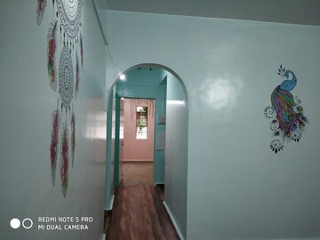 Living Room in 2 BHK Apartment at Vijay Vanaz Pariwar CHS, Kothrud – for Rent