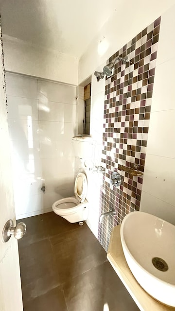 Bathroom in 1 BHK Apartment at Unique Signature Mumbai, Mira Road – for Rent