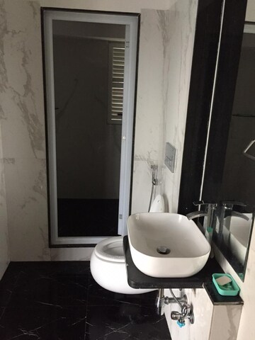 Bathroom in 2 BHK Apartment at Ruparel Ariana, Parel – for Rent