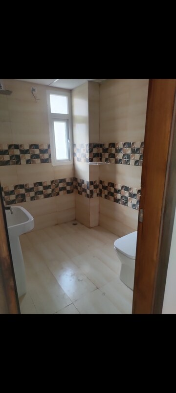 Bathroom in 3 BHK Apartment at Uninav Bliss, Raj Nagar Extension – for Rent