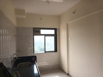 Kitchen in 2 BHK Apartment at Pranjee Garden City, Katrap – for Sale