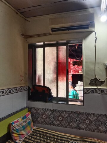 Bedroom in 1 RK Apartment at Nilgiri Upvan CHS, Gawand Baug – for Rent