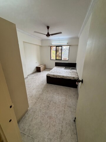 Master Bedroom in 1 BHK Apartment at Montana CHS, Andheri West – for Rent