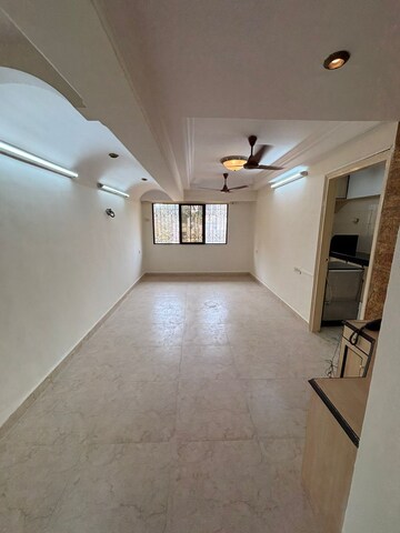 Living Room in 1 BHK Apartment at Montana CHS, Andheri West – for Rent