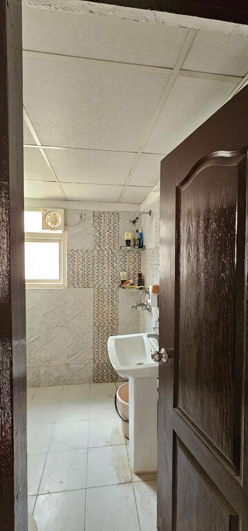 Bathroom in 2 BHK Apartment at Aims Golf Avenue I, Sector 75 – for Rent