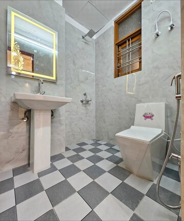 Bathroom in 2 BHK Apartment at Nilaya Greens, Raj Nagar Extension – for Rent