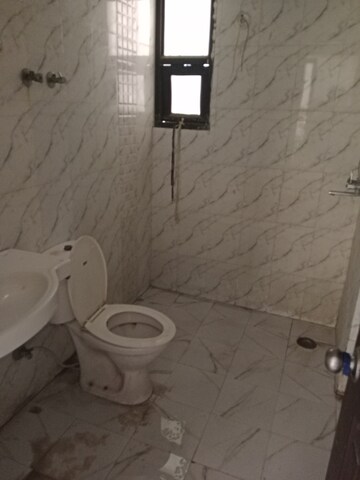 Bathroom in 3 BHK Apartment at Raj Nagar Extension – for Rent