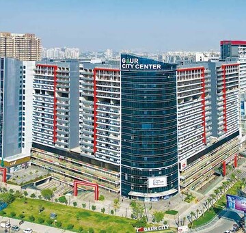 Living Room in Studio Apartment at Gaur City Center, Sector 4, Greater Noida – for Sale