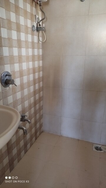 Bathroom in 1 BHK Apartment at Raunak Delight, Owale – for Rent