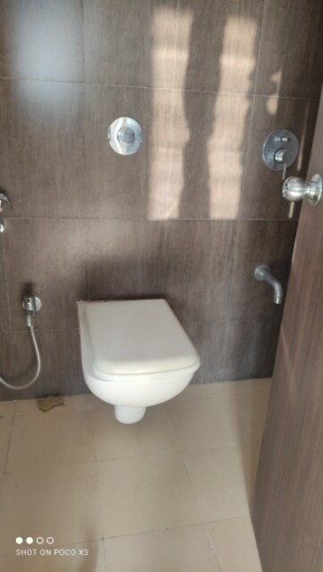 Bathroom in 1 BHK Apartment at Raunak Delight, Owale – for Rent