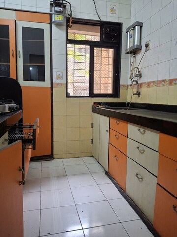 Kitchen in 2.5 BHK Apartment at Mudit Garden, Kopar Khairane – for Rent