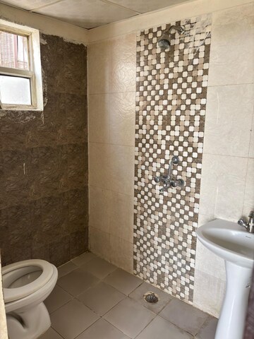 Bathroom in 2 BHK Apartment at Devika Skypers, Raj Nagar Extension – for Rent