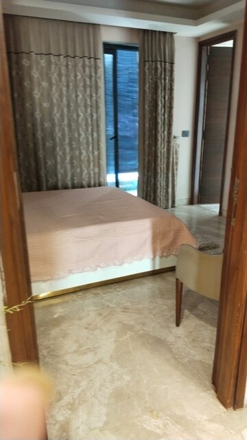 Bedroom in 4 BHK Builder Floor at Ansal API Esencia, Sector 67 – for Rent