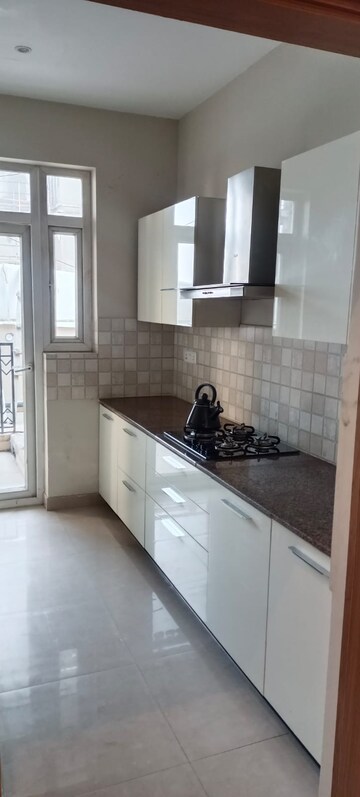 Kitchen in 3.5 BHK Apartment at ATS Homekraft Pious Hideaways, Sector 150 – for Sale