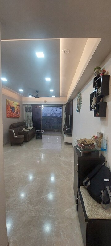 Living Room in 3 BHK Apartment at T Bhimjyani Neelkanth Woods, Manpada – for Sale