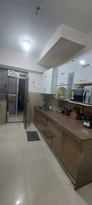 Kitchen in 3 BHK Apartment at T Bhimjyani Neelkanth Woods, Manpada – for Sale
