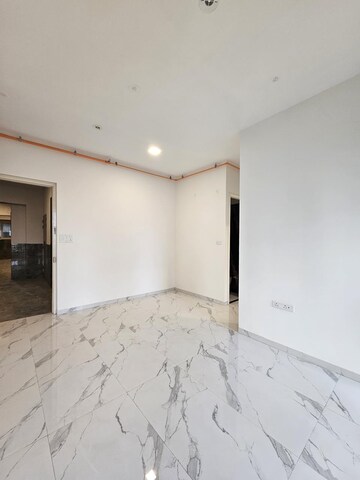 Living Room in 2 BHK Apartment at Kandivali West – for Sale