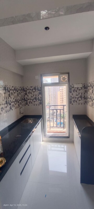 Kitchen in 1 BHK Apartment at Raunak Bliss, Ghodbunder Road – for Rent