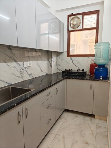 Kitchen in 2 BHK Builder Floor at Freedom Fighters Enclave – for Rent