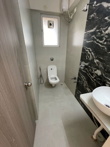 Bathroom in 2 BHK Apartment at Unique Ivana, Mira Road – for Rent