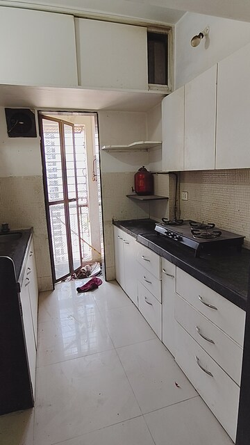 Kitchen in 1.5 BHK Apartment at Hubtown Gardenia, Mira Road – for Sale