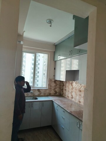 Kitchen in 2.5 BHK Apartment at Amrapali Golf Homes, Sector 4, Greater Noida – for Rent