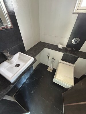 Bathroom in 2 BHK Apartment at Rosa Bella, Pratha Pushp Society – for Sale