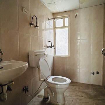 Bathroom in 3 BHK Apartment at Ushay Towers, New Tara Nagar – for Rent