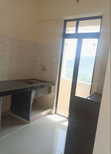 Kitchen in 1 BHK Apartment at Pushpanjali Heights, Owale – for Rent