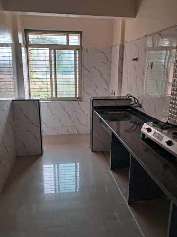Kitchen in 2 BHK Apartment at Mohan Willows, Badlapur East – for Rent