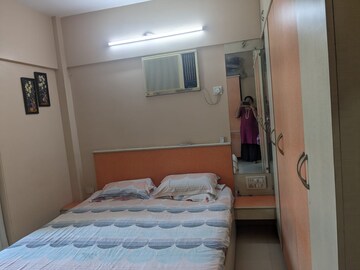 Bedroom in 2 BHK Apartment at Lokhandwala Breeze Apartments, Andheri West – for Rent