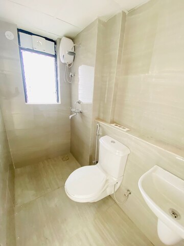Bathroom in 1 BHK Apartment at Runwal Gardens, Dombivli East – for Rent