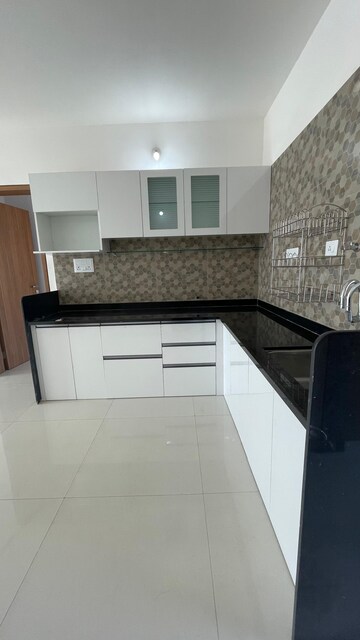 Kitchen in 2.5 BHK Apartment at Kohinoor Viva City, Dhanori – for Rent