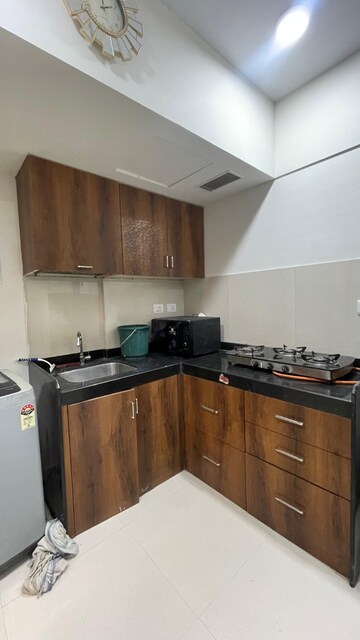Kitchen in Studio Apartment at JP North Elara, Mira Road – for Rent