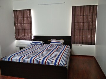 Bedroom in 4 BHK Apartment at Adani Shantigram Water Lily, Shantigram – for Rent