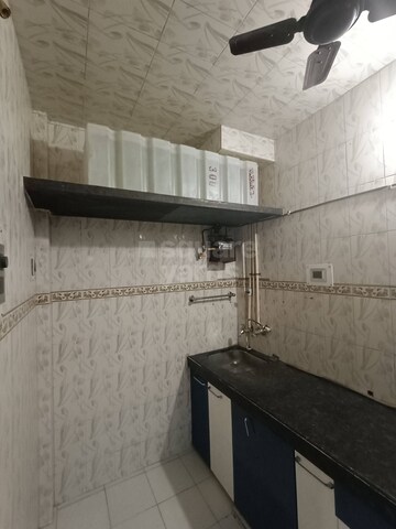 Kitchen in 2 BHK Apartment at Plaza Vihar CHS, Mira Road – for Rent