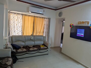 Living Room in 1 BHK Apartment at Raunak Bliss, Ghodbunder Road – for Rent