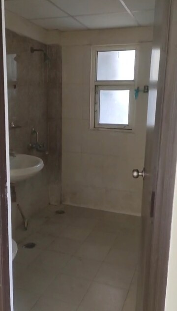 Bathroom in 2 BHK Apartment at Kingswood Court, Sain Vihar – for Rent