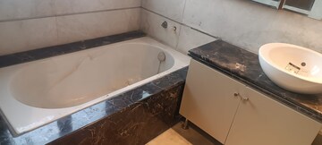 Bathroom in 4 BHK Apartment at Kailash Colony – for Sale
